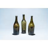 Three green glass wine bottles with crowned seals, 18/19th C.