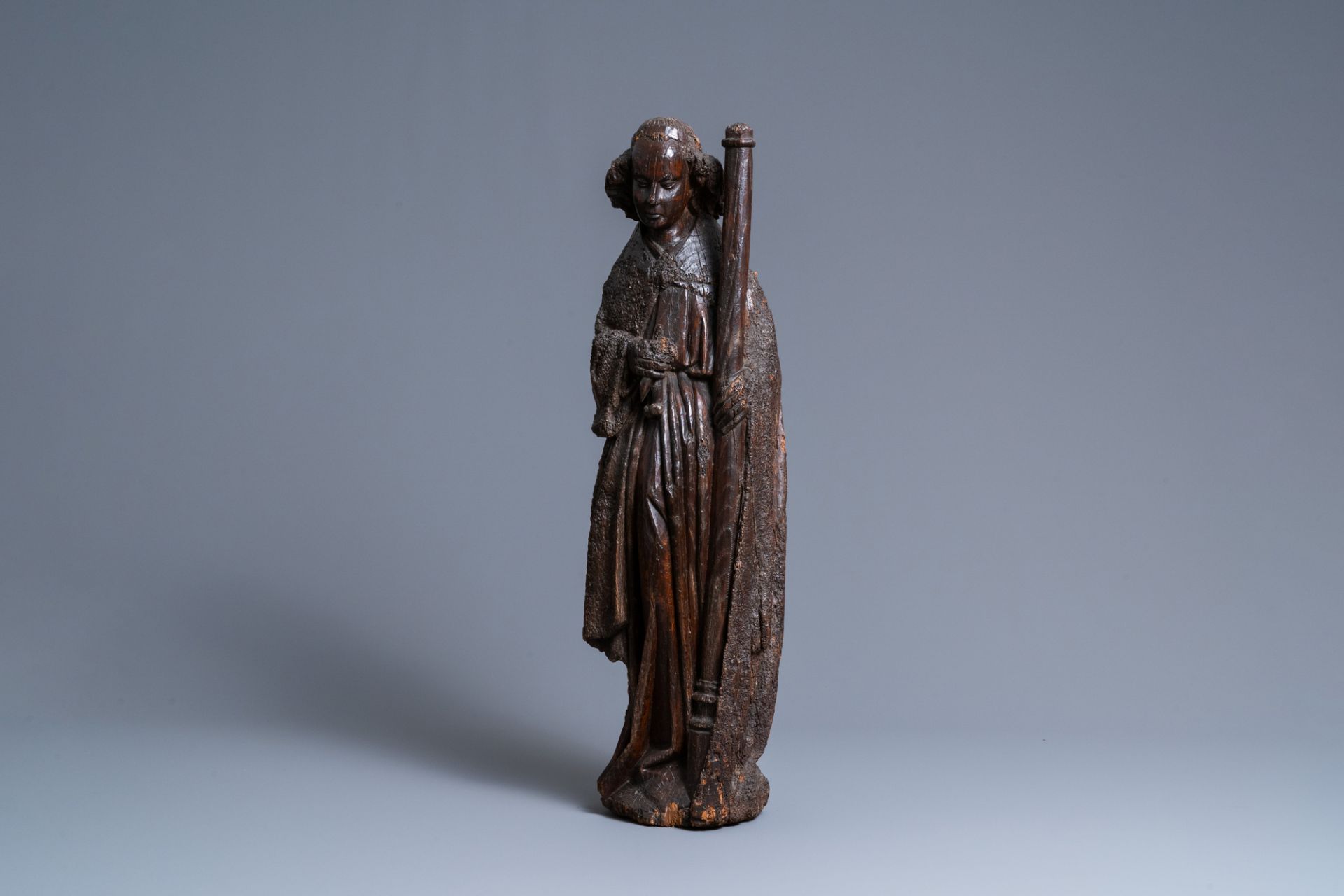 An oak figure of an angel holding the Instruments of the Passion, Brabant region, Southern Netherlan