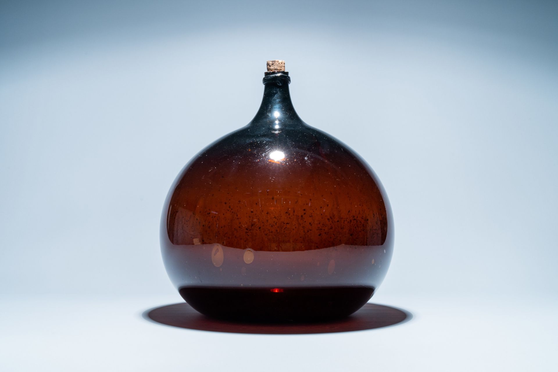 A large brown glass bottle, 18th C.