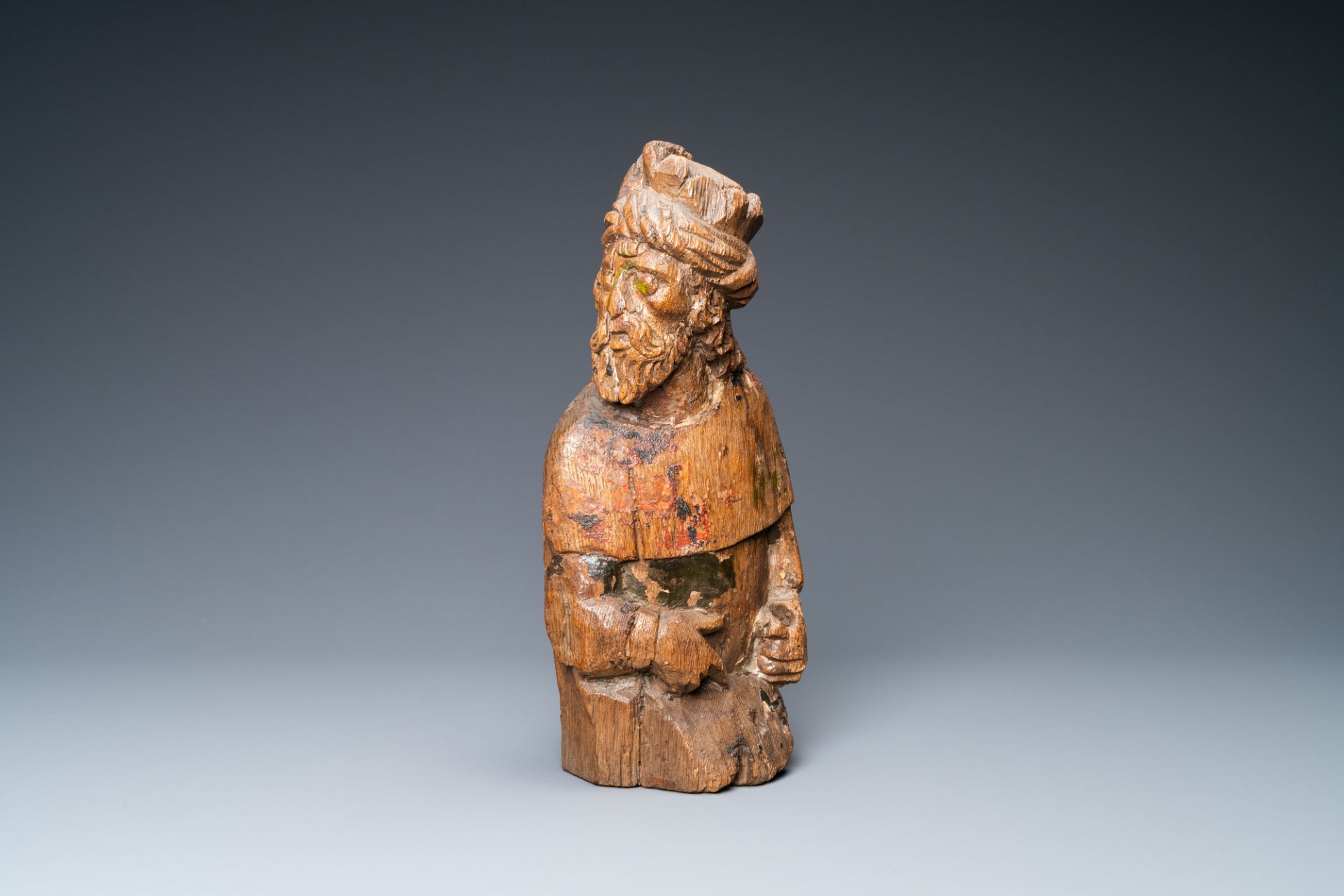 An oak figure of a prophet with traces of polychromy, 16th C.