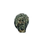 A Romanesque painted glass fragment depicting the head of Christ, France, 11/12th C.