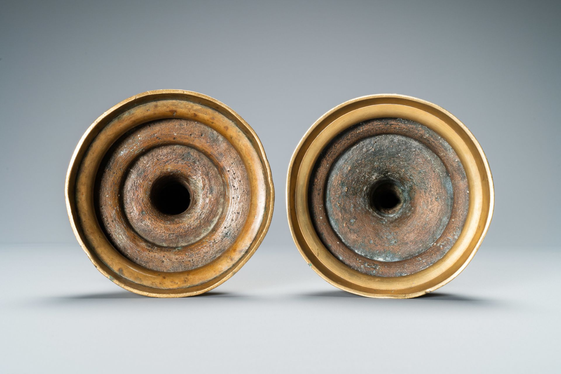 A composite pair of brass alloy candlesticks, Germany, 16th C. - Image 7 of 7