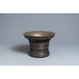 A large bronze mortar dated 1557 and inscribed for Martin Doeulle, North of France