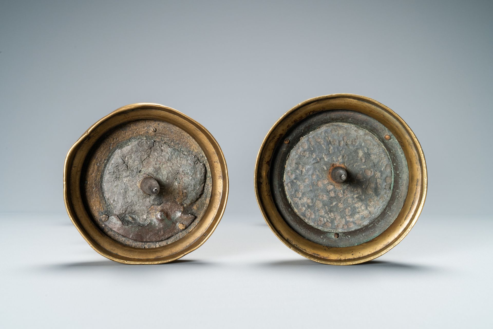 A composite pair of brass alloy candlesticks, Germany, 16th C. - Image 6 of 7