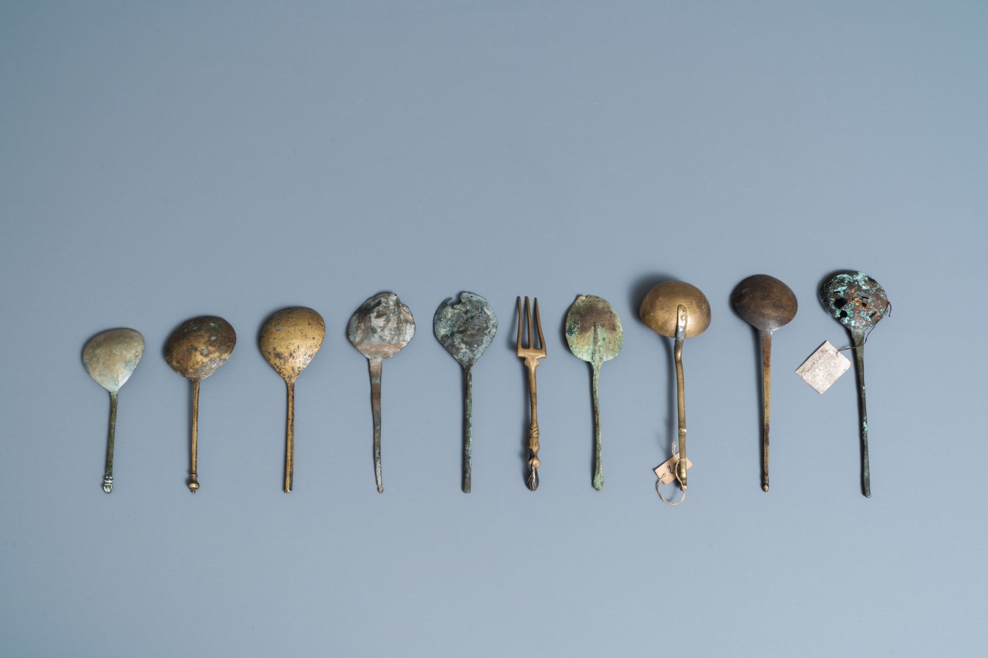 Nine brass spoons and a small fork, 15/16th C. - Image 4 of 4