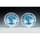 A pair of ribbed Dutch Delft blue and white 'tea tree' plates, 18th C.