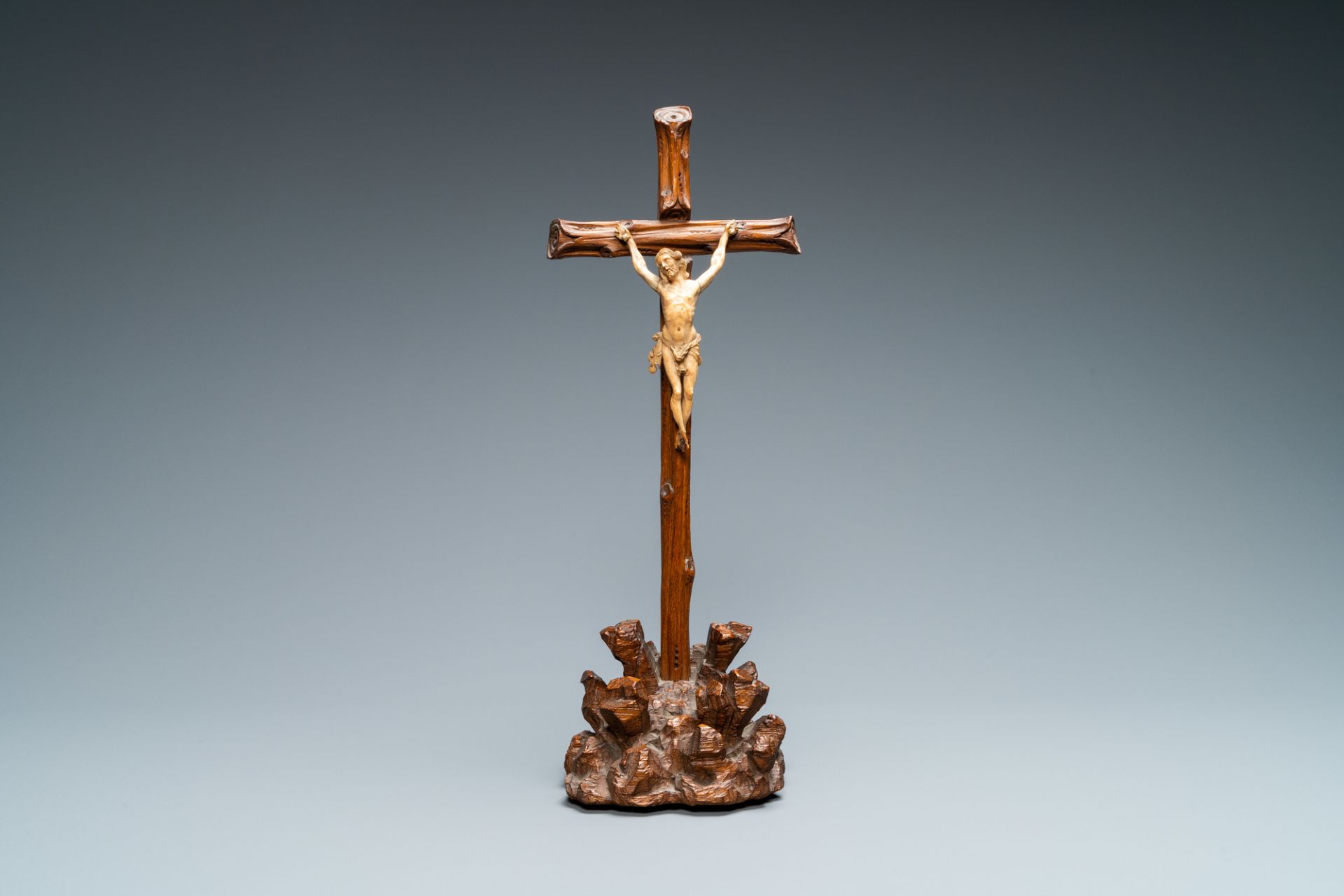 An ivory Corpus Christi on naturalistically carved wooden crucifix, probably France, 17/18th C.