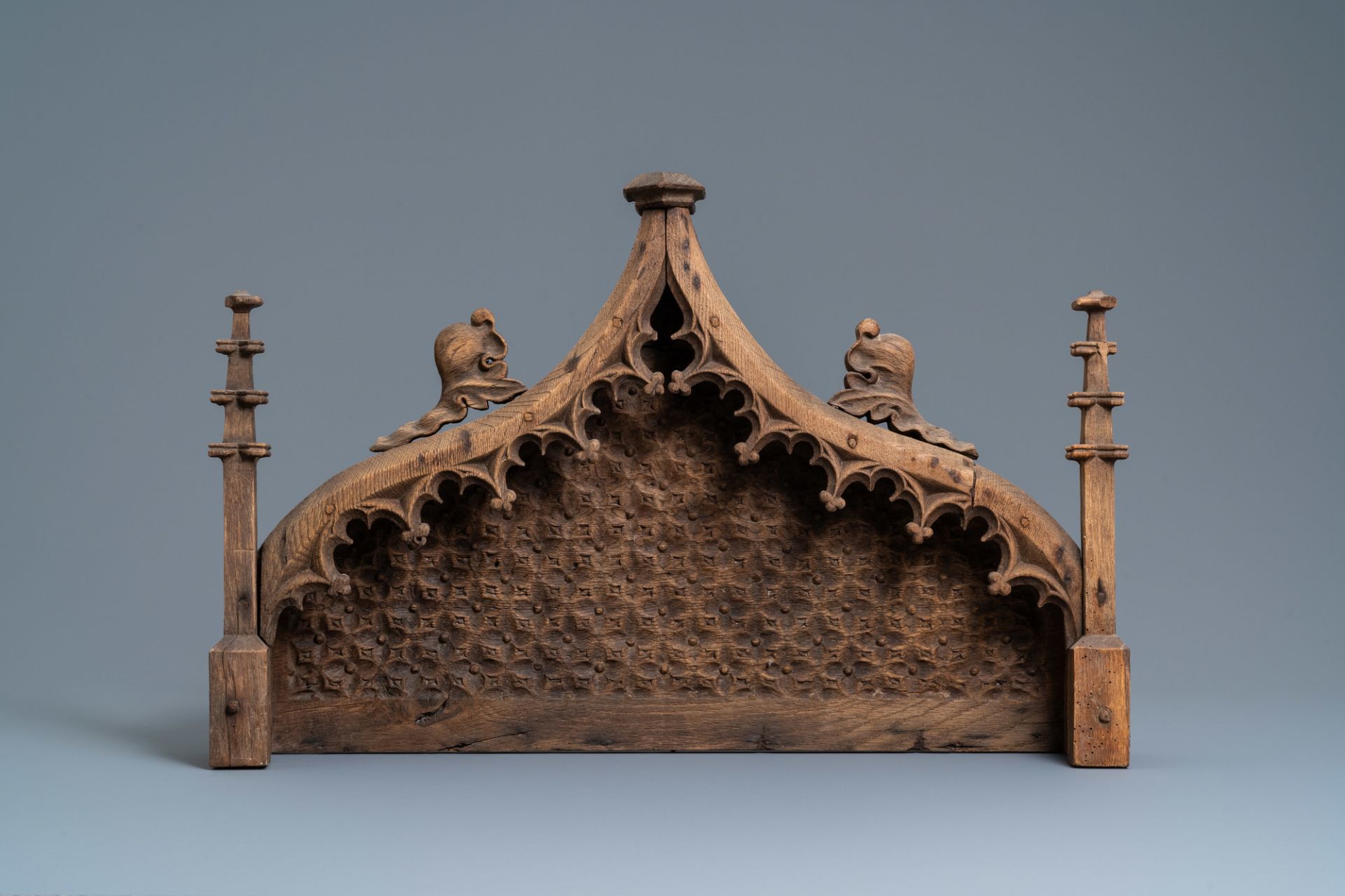 An arch-shaped carved oak baldachin or throne top, France, 15th C.