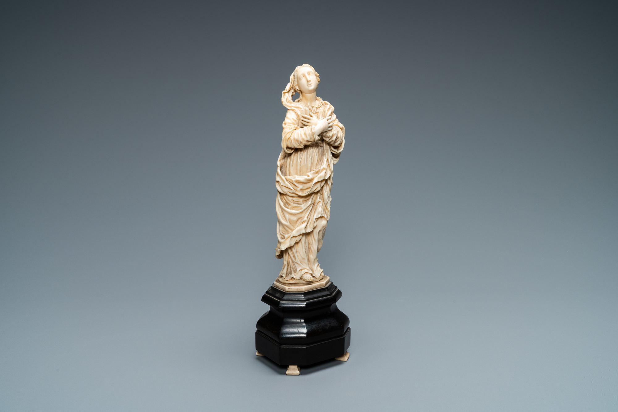 An ivory figure of a Madonna on wooden stand, Flanders or Germany, 17th C.