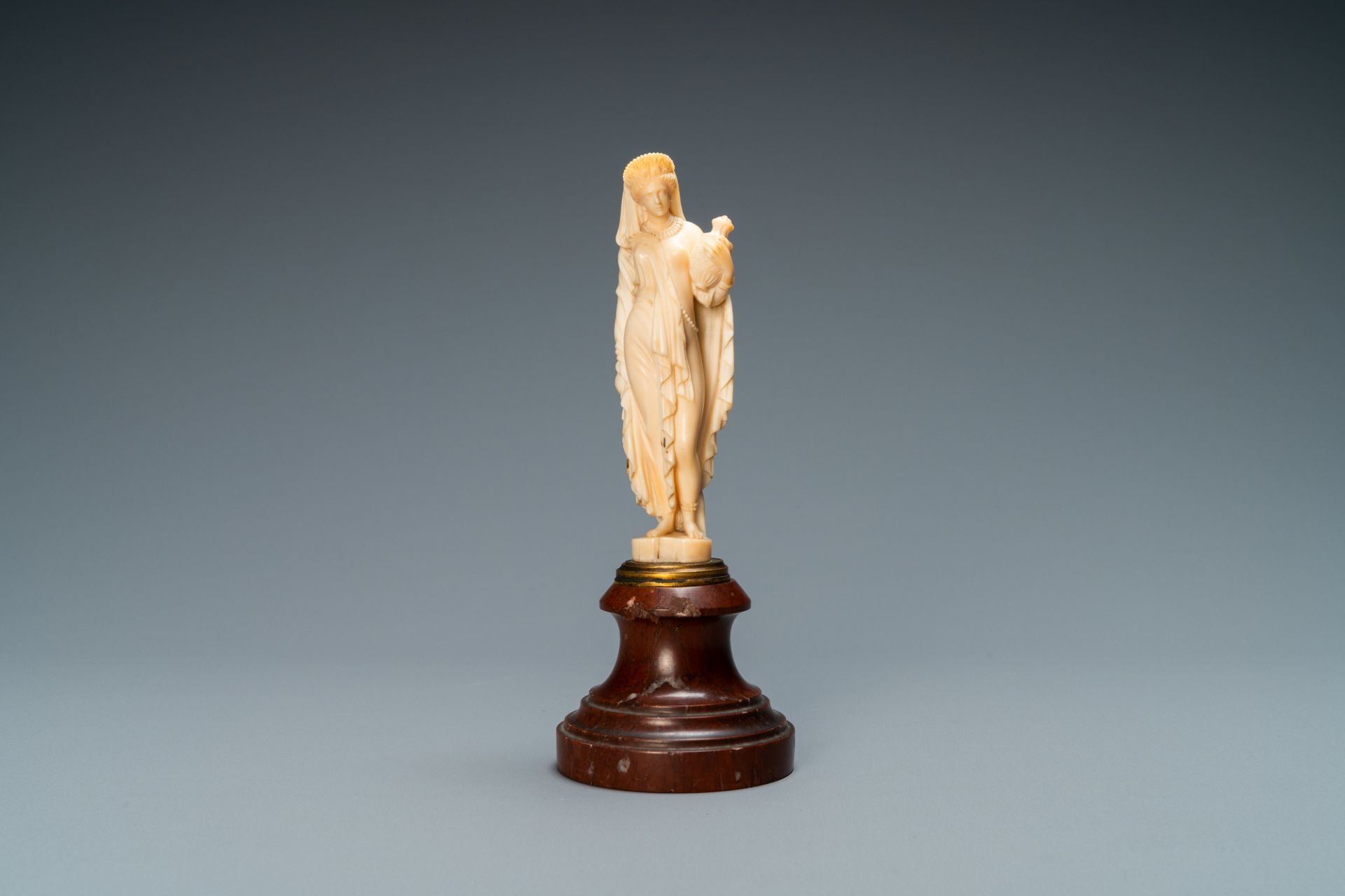 An ivory figure of a woman dressed after the antique holding a vase, probably Dieppe, France, 19th C - Image 2 of 8