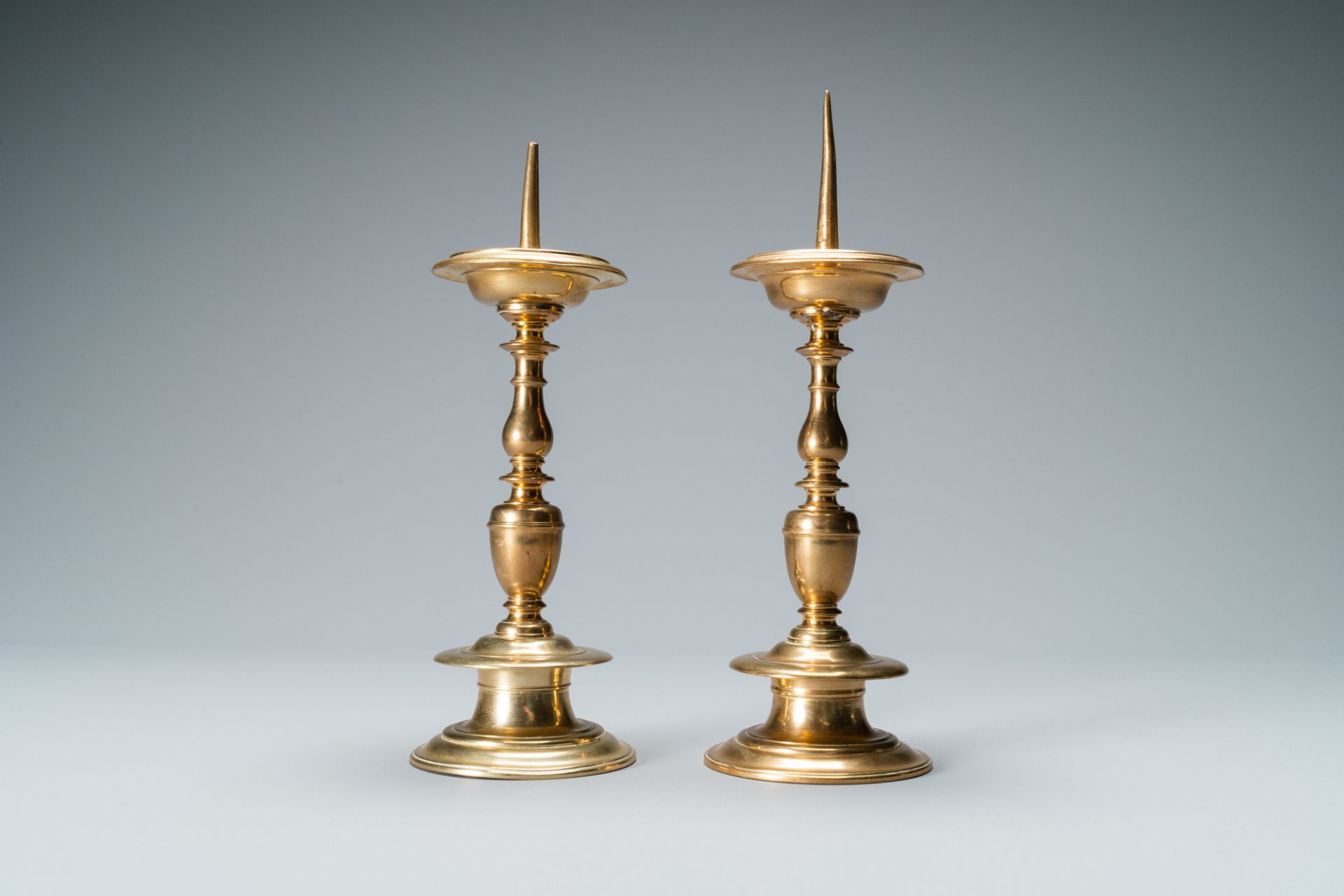 A pair of brass alloy candlesticks, Italy, 17th C. - Image 5 of 7
