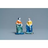 A pair of polychrome Dutch Delft figures of market ladies, 18th C.