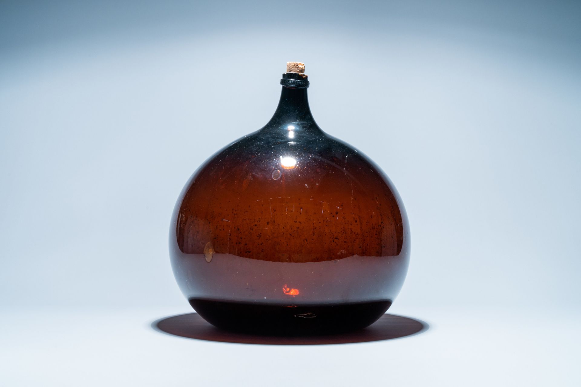 A large brown glass bottle, 18th C. - Image 3 of 6