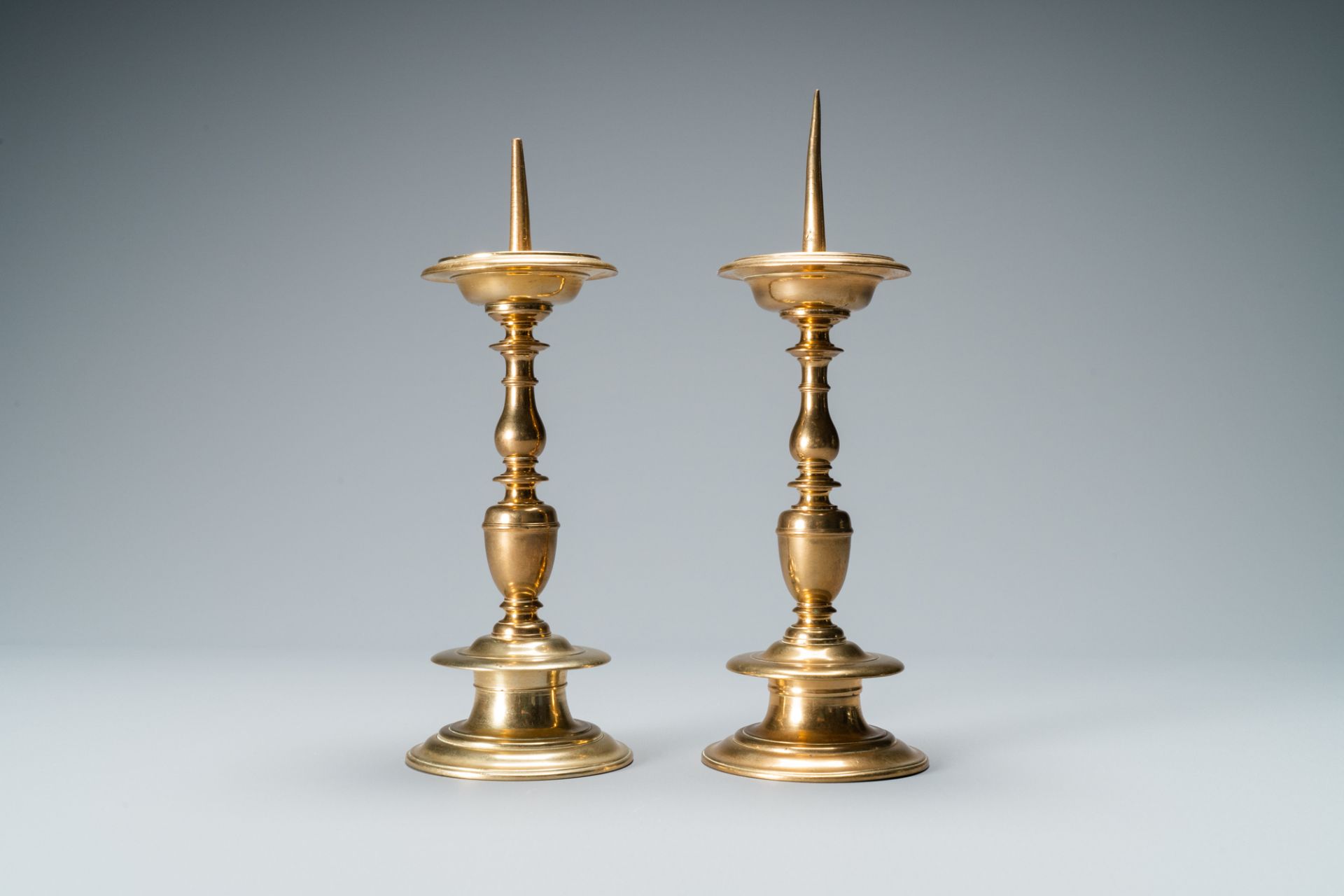 A pair of brass alloy candlesticks, Italy, 17th C. - Image 3 of 7