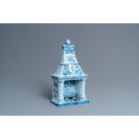 A Dutch Delft blue and white fireplace-shaped box and cover, ca. 1800