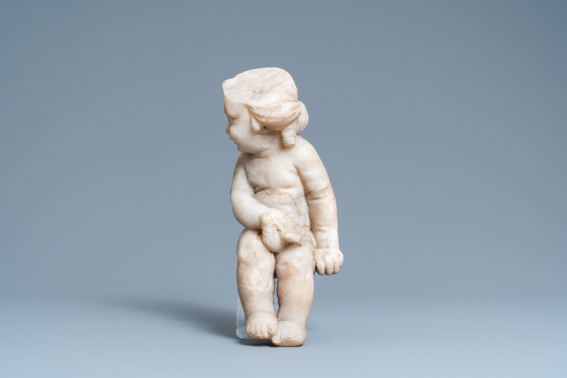 An alabaster figure of a putto with a bird on the knee, 17th C. - Image 4 of 8