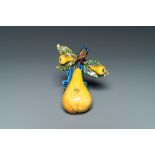 A polychrome Dutch Delft group of three pears, 18th C.