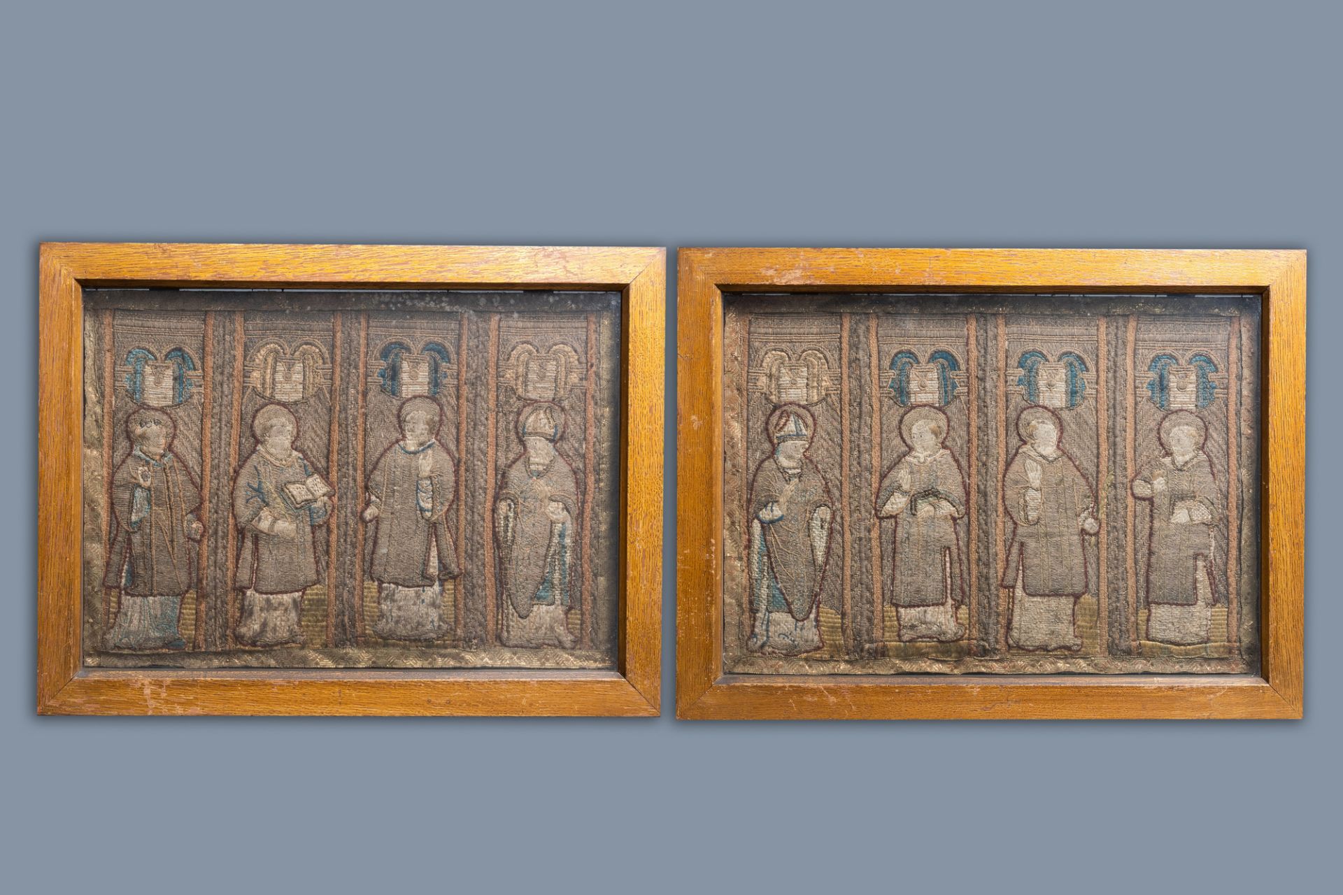Two large linen, silk- and silverthread orphrey fragments depicting saints below arcatures, Spain, e