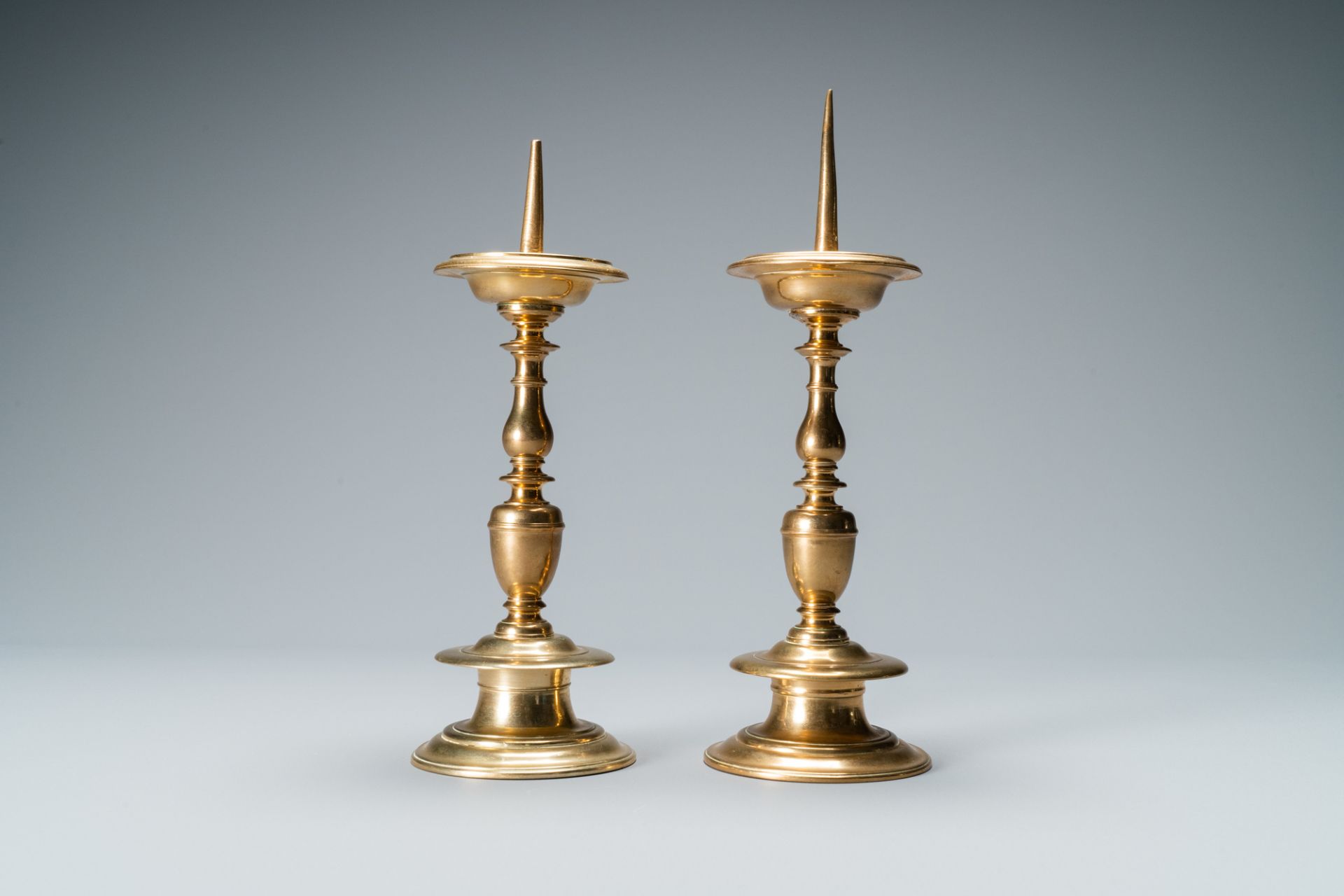 A pair of brass alloy candlesticks, Italy, 17th C. - Image 4 of 7