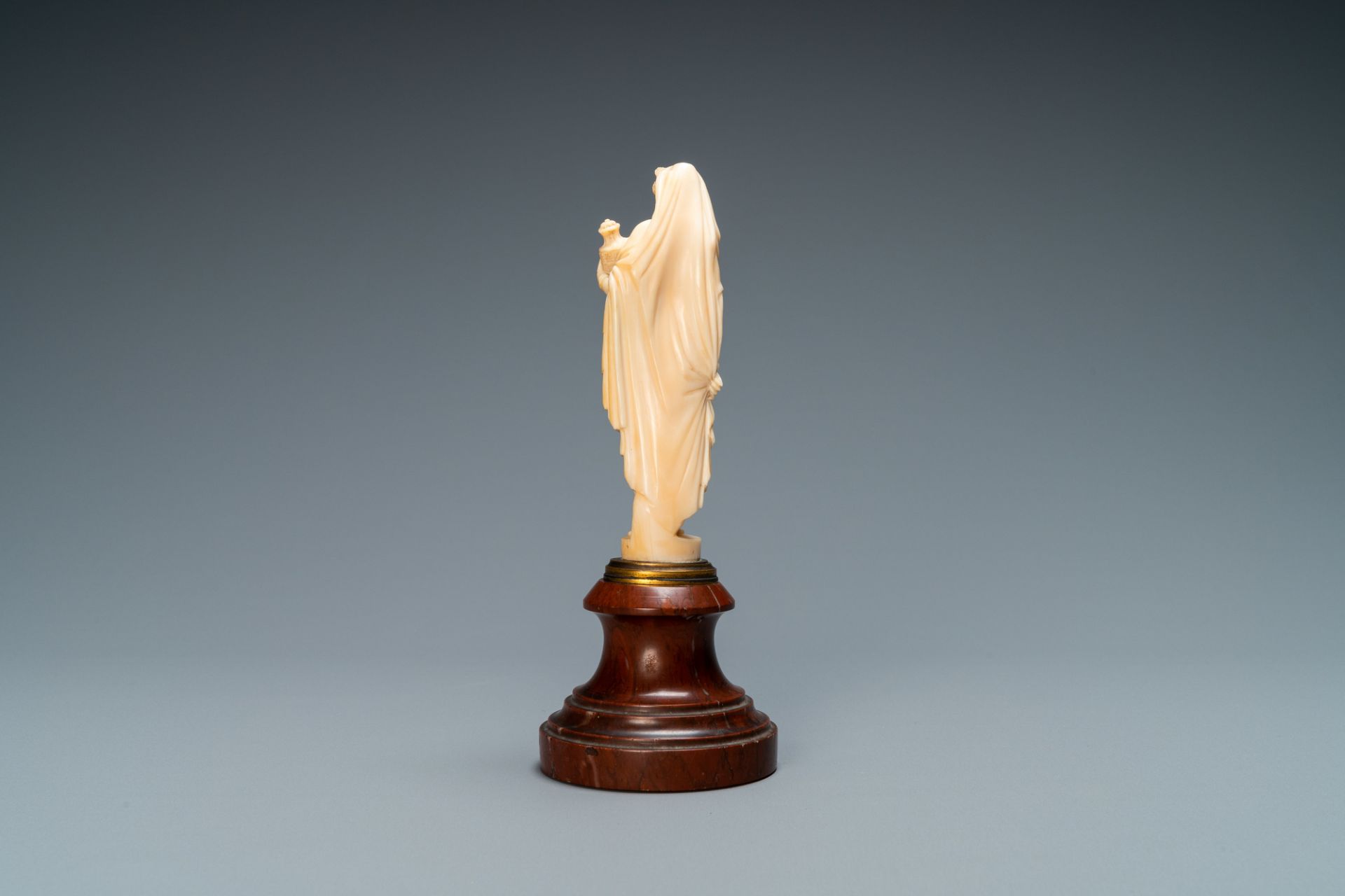 An ivory figure of a woman dressed after the antique holding a vase, probably Dieppe, France, 19th C - Image 5 of 8