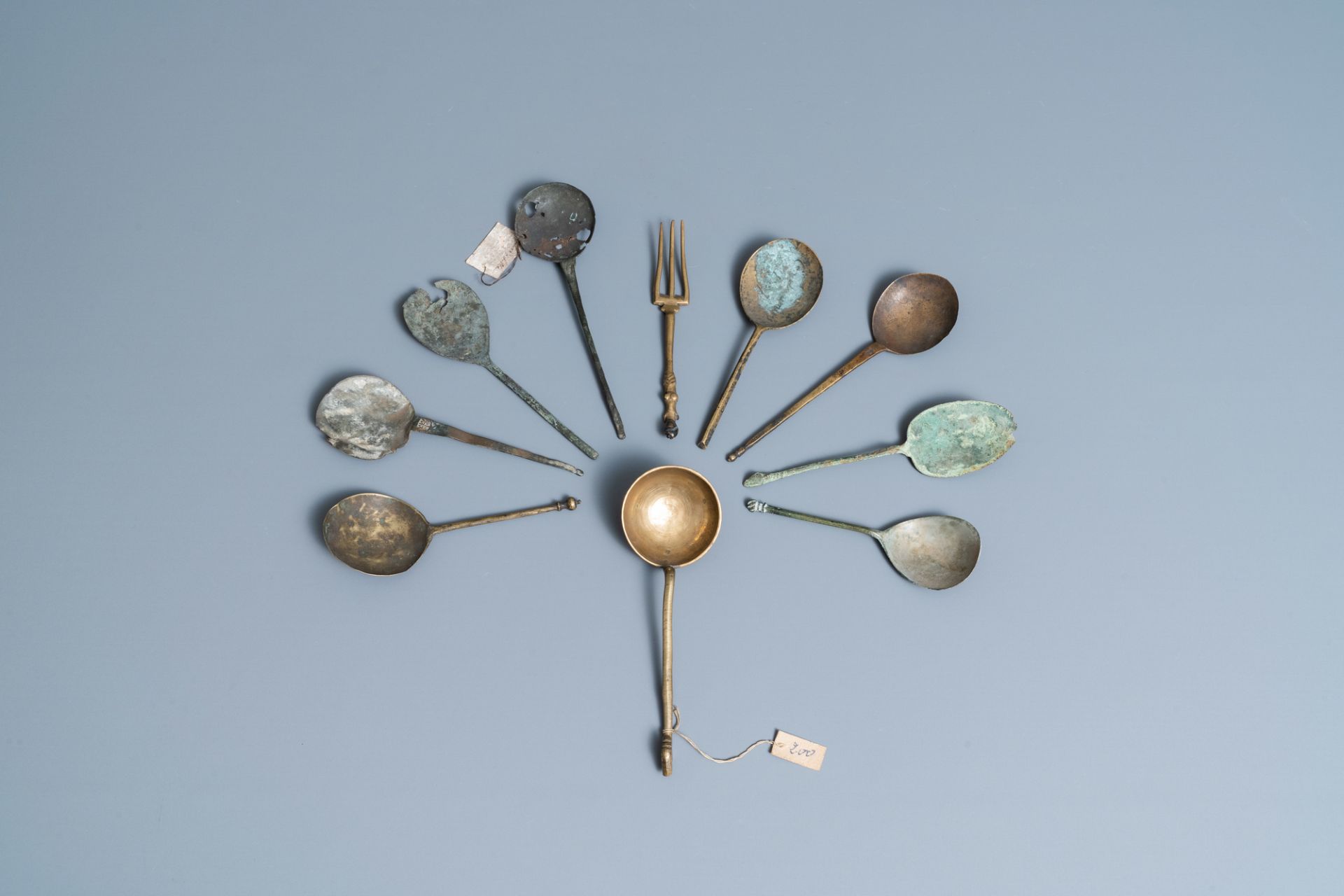 Nine brass spoons and a small fork, 15/16th C. - Image 2 of 4