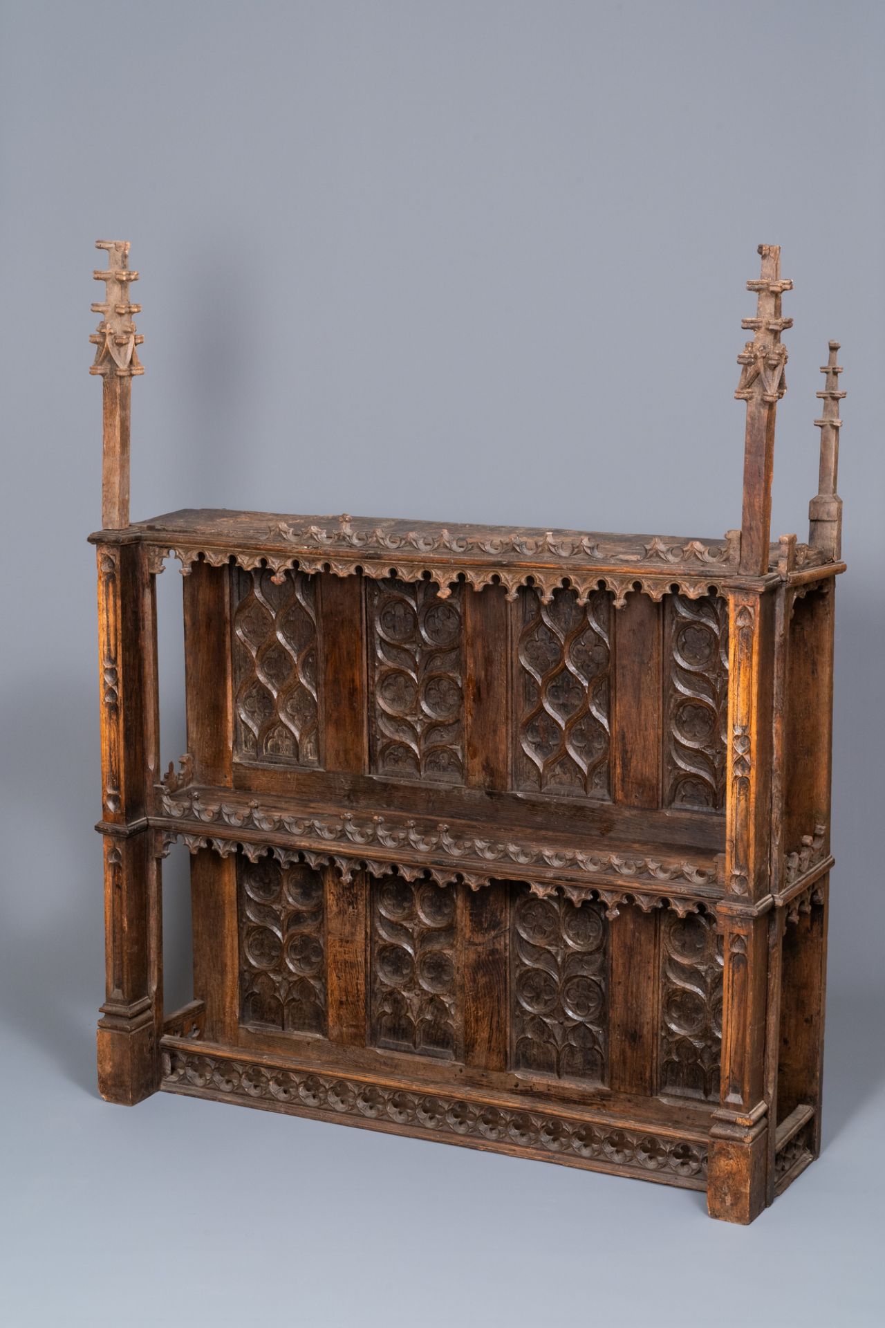 A carved oak shelf with pinnacles and stylised flowers and carved panels, 15th C. and later - Image 2 of 12