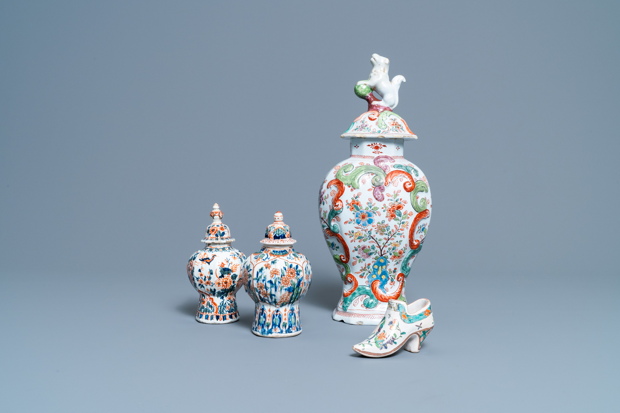 A polychrome petit feu and gilded Dutch Delft covered vase, a shoe and a pair of cashmere palette co