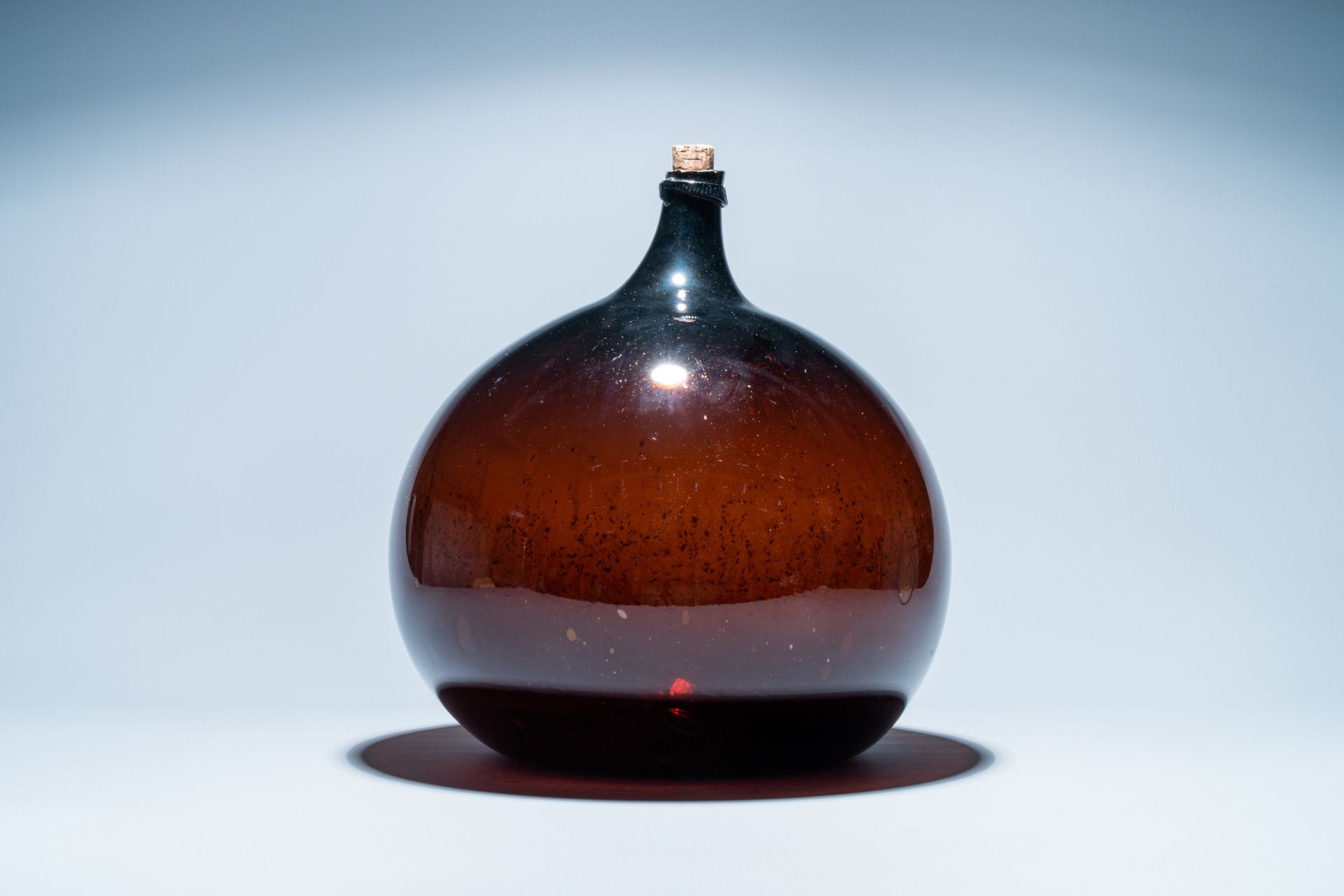 A large brown glass bottle, 18th C. - Image 4 of 6
