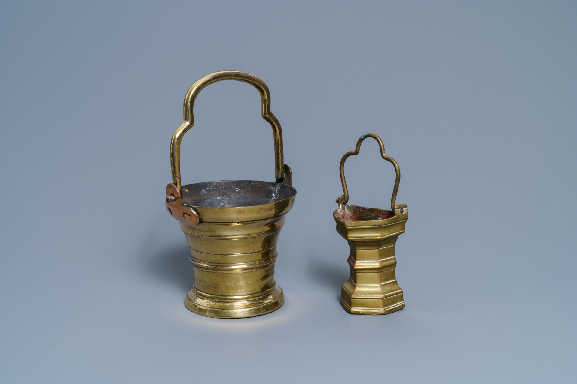 Two Flemish bronze holy water buckets, 1st half 16th C.