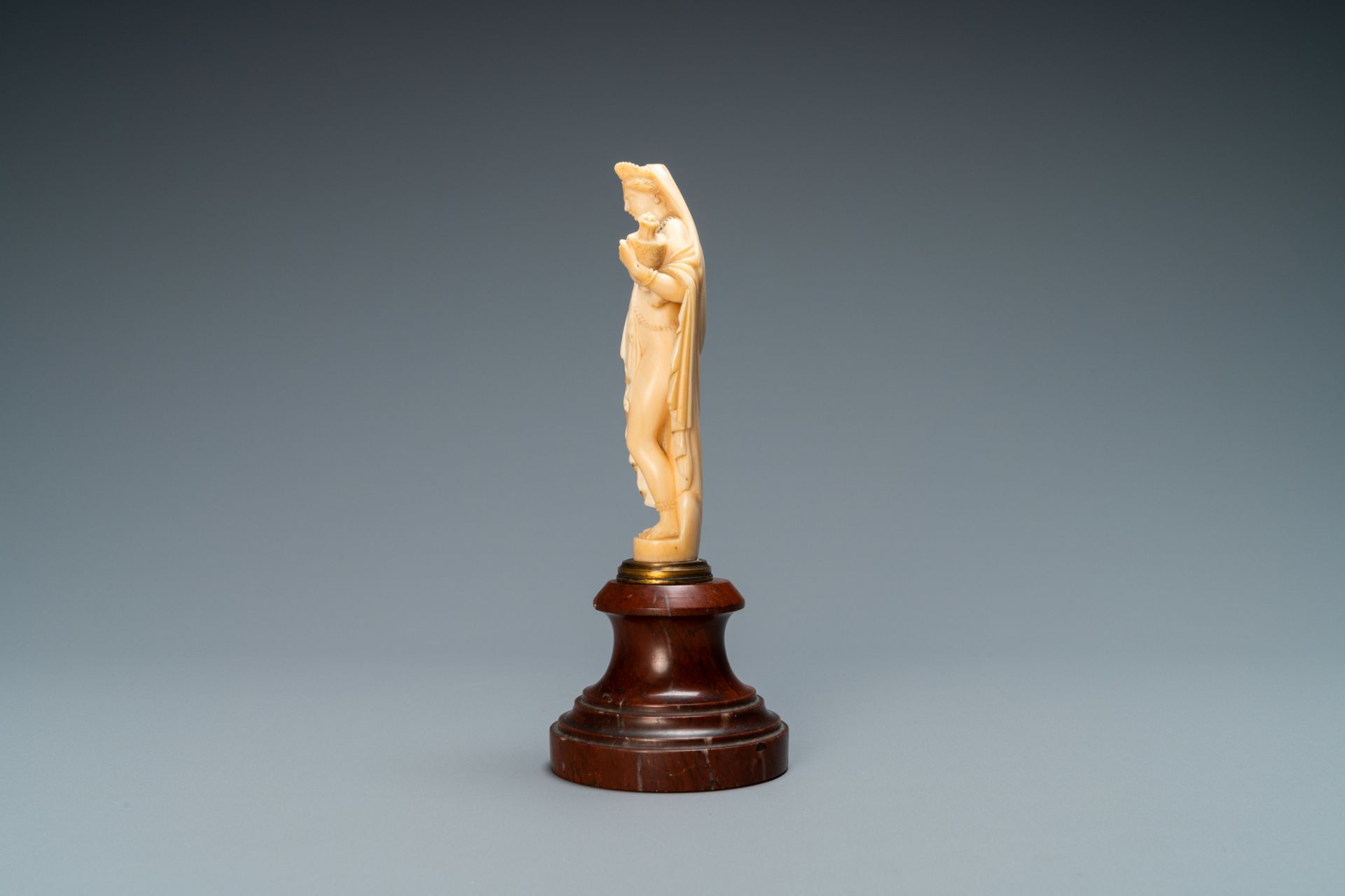 An ivory figure of a woman dressed after the antique holding a vase, probably Dieppe, France, 19th C - Image 4 of 8