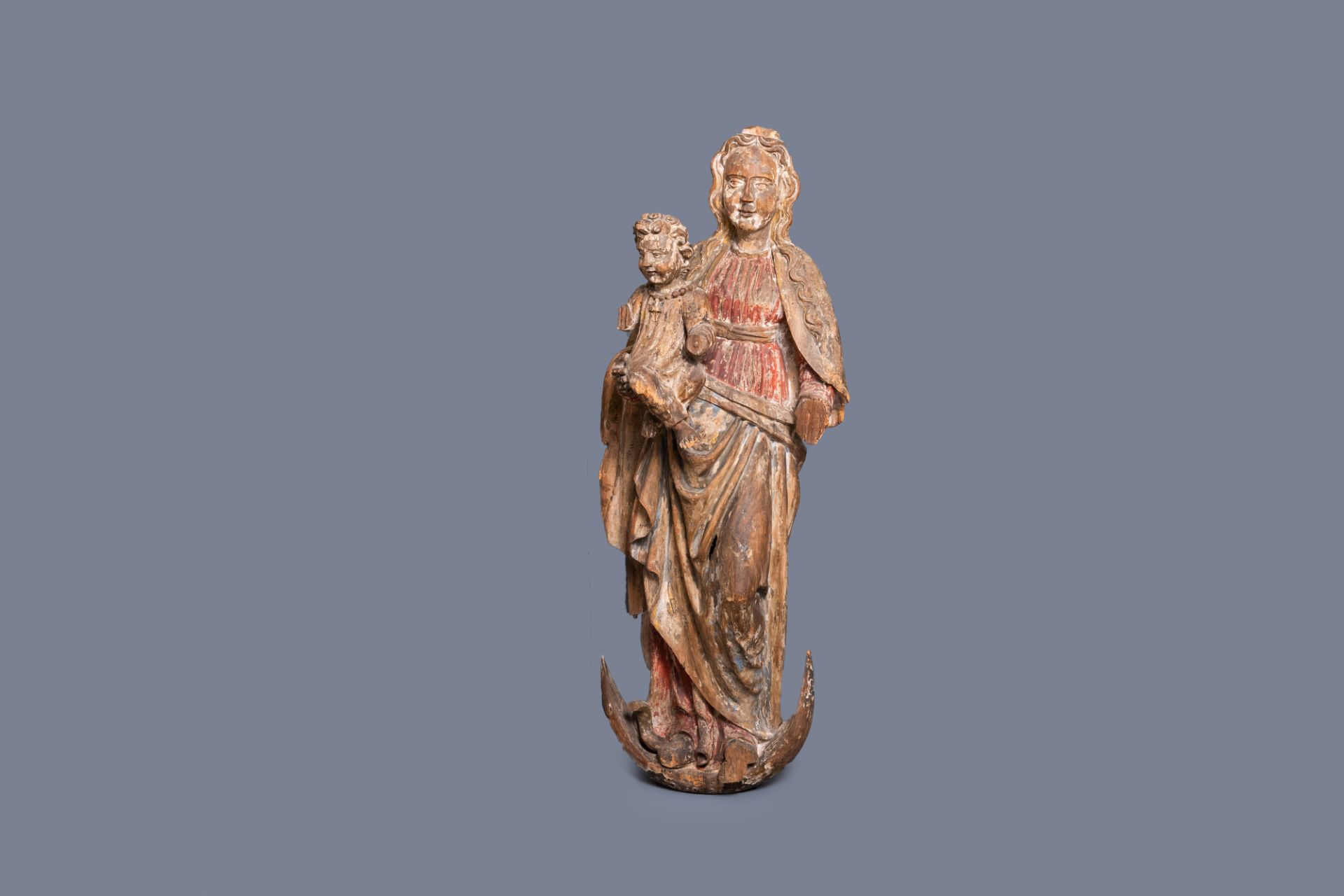 A large polychromed limewood figure of a Madonna with child, Germany, 15th C.