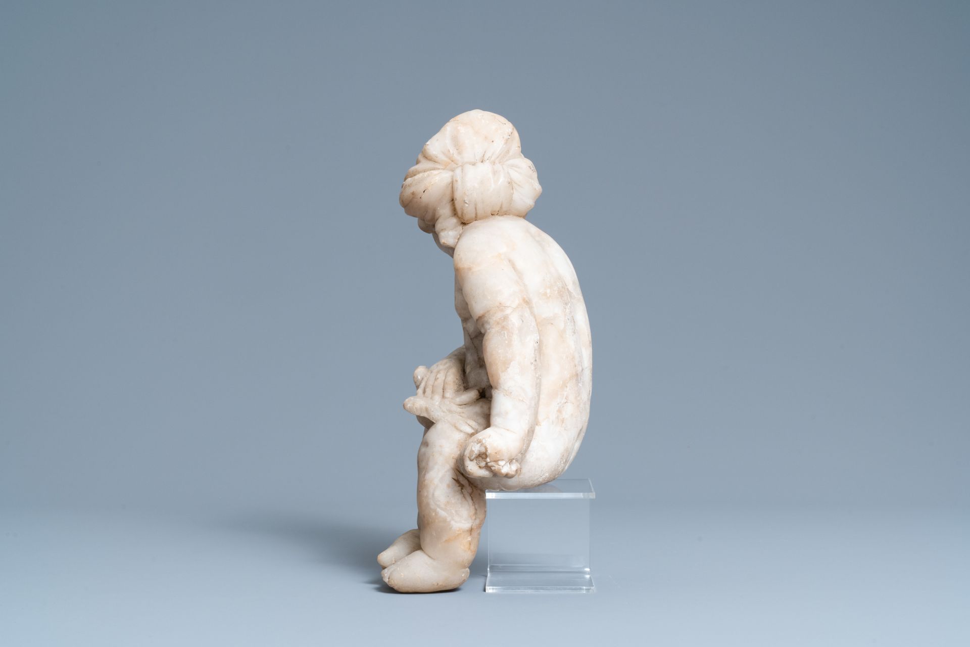 An alabaster figure of a putto with a bird on the knee, 17th C. - Image 5 of 8