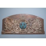 A large polychromed carved oak panel with putti and trophies flanking the royal coat of arms of Fran