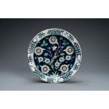 A blue-ground Iznik-style pottery dish, Kutahya, Turkey, 19th C.