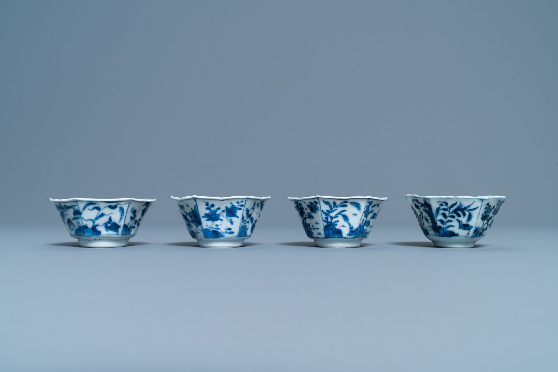 A pair of Chinese blue and white vases, a 'lotus' dish and four cups, Kangxi - Image 12 of 15
