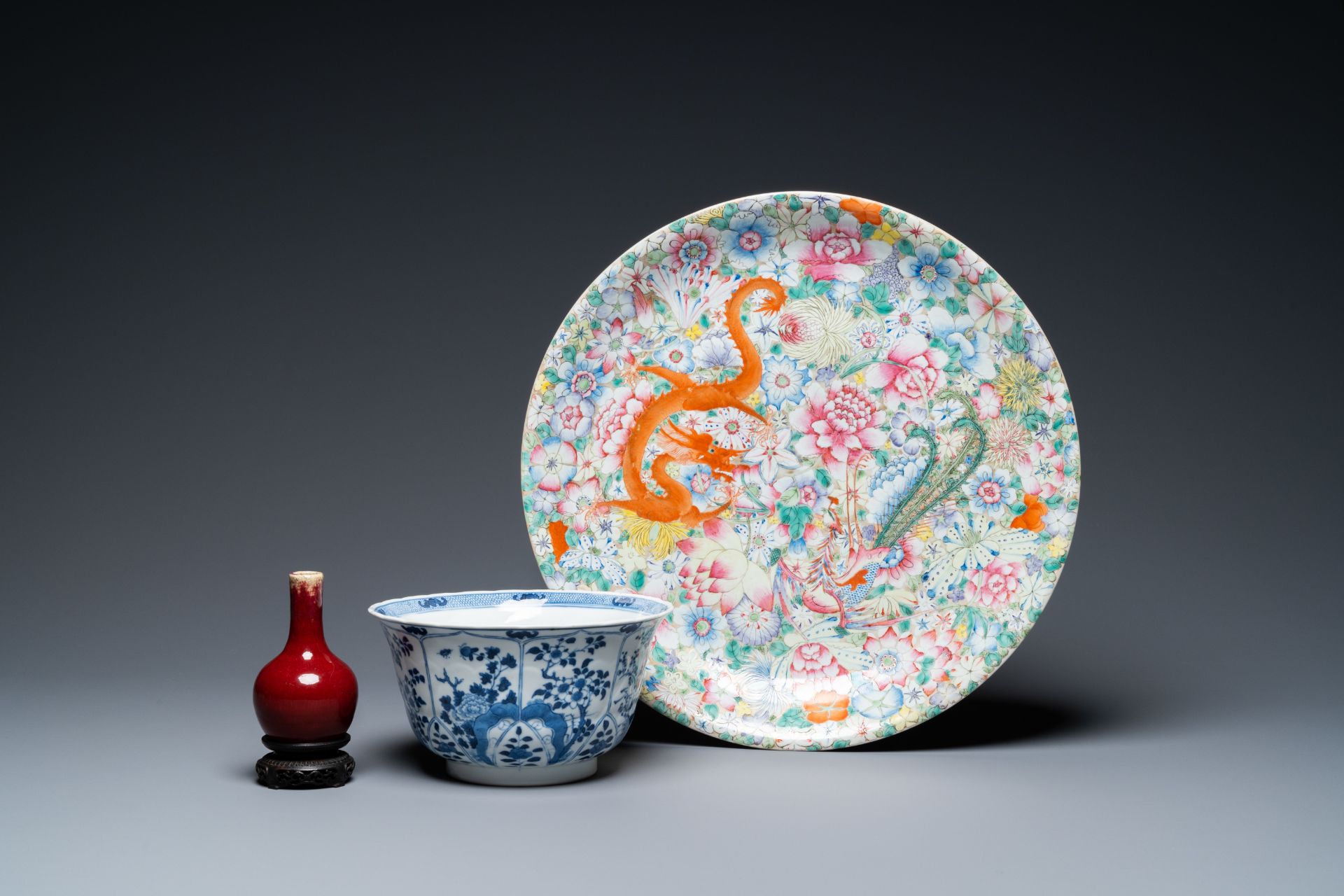 A Chinese famille rose dish, a blue and white bowl and a sang de boeuf vase, 19/20th C.