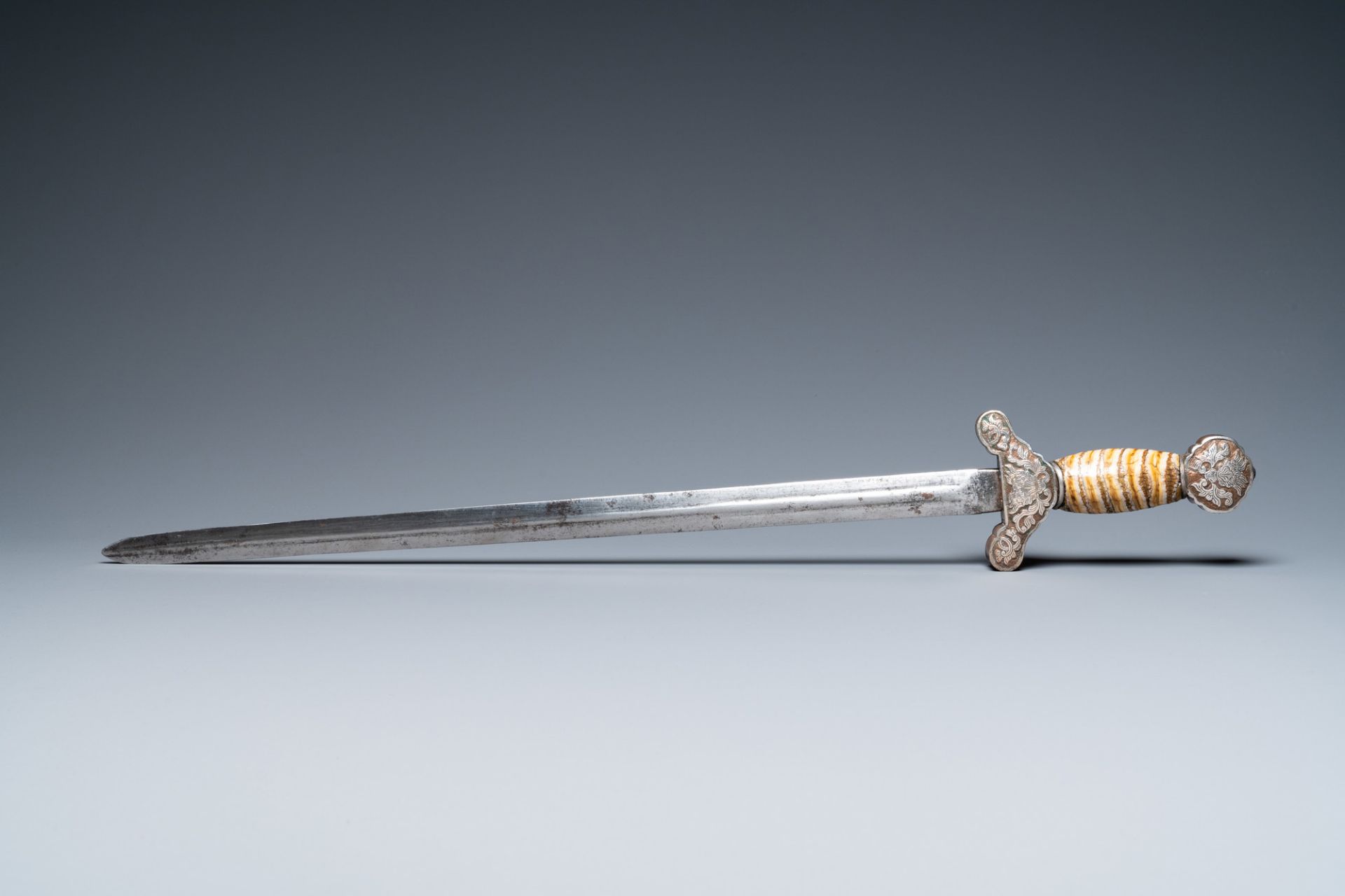 A Tibetan steel sword with silvered copper and mammoth tooth hilt, 19th C. - Image 3 of 7