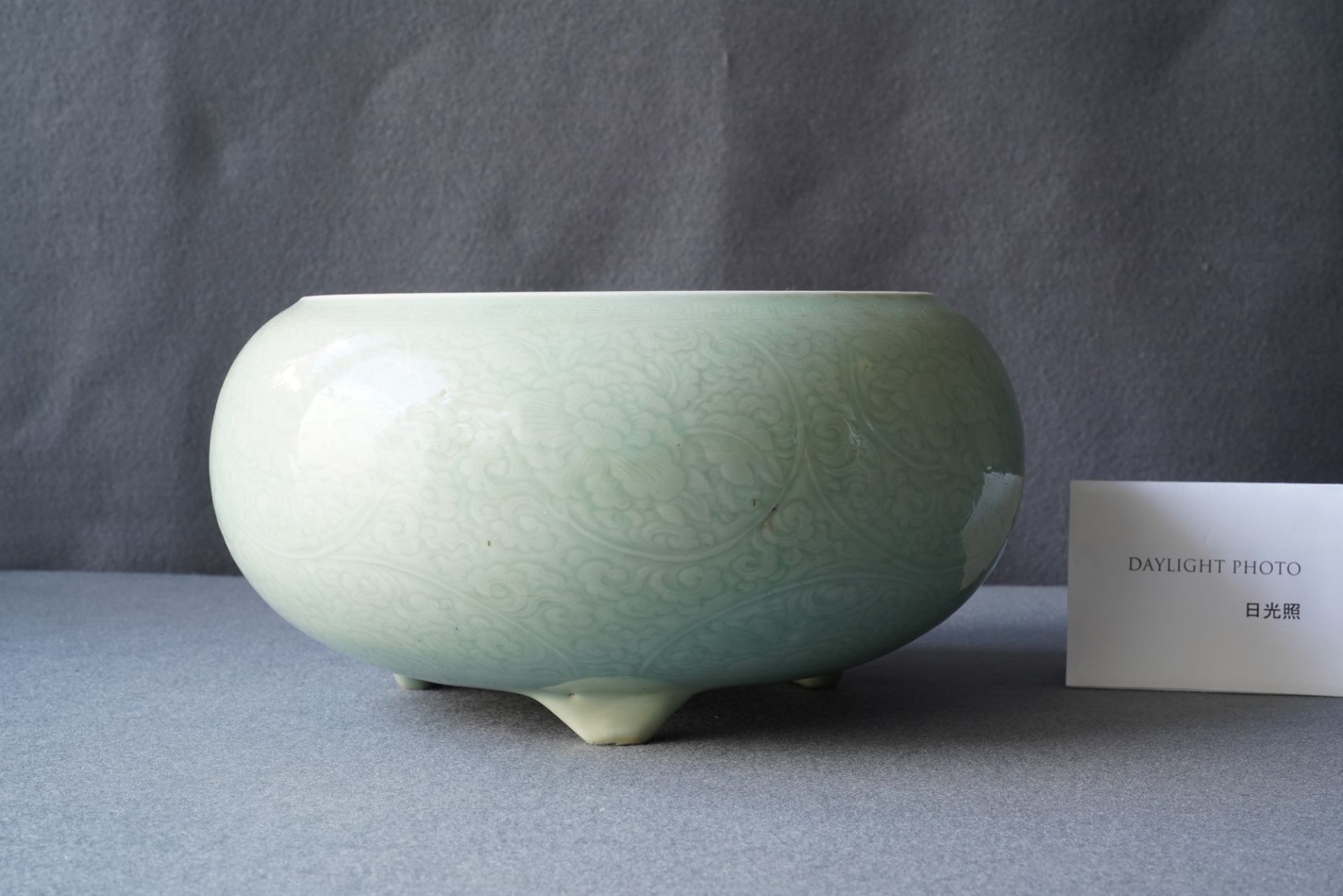 A Chinese celadon-glazed tripod censer with incised underglaze design, Kangxi - Image 8 of 26