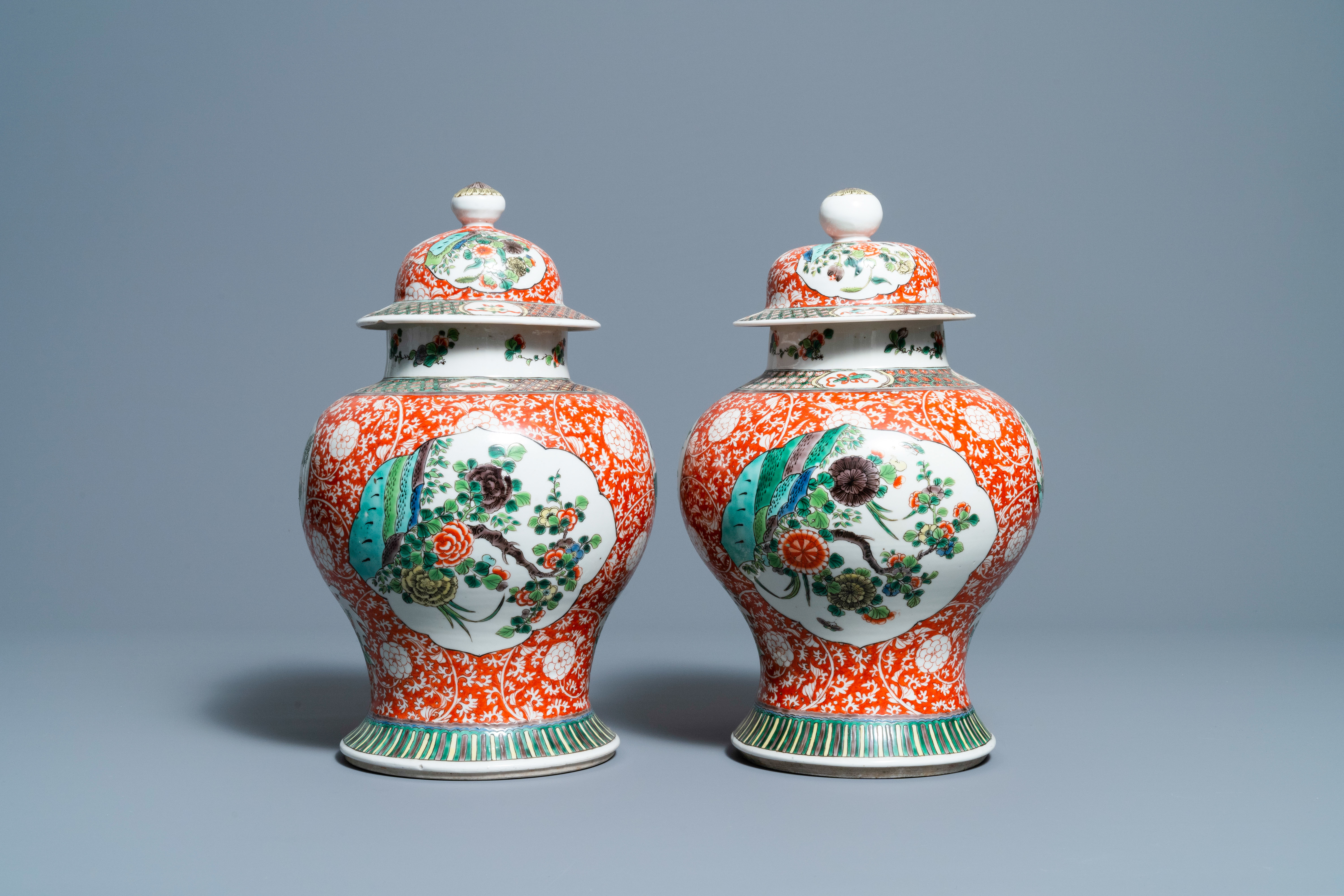 A pair of Chinese famille verte vases and covers, 19/20th C.