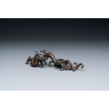 A rare Chinese bronze 'dragon' brush rest, Yuan/Ming