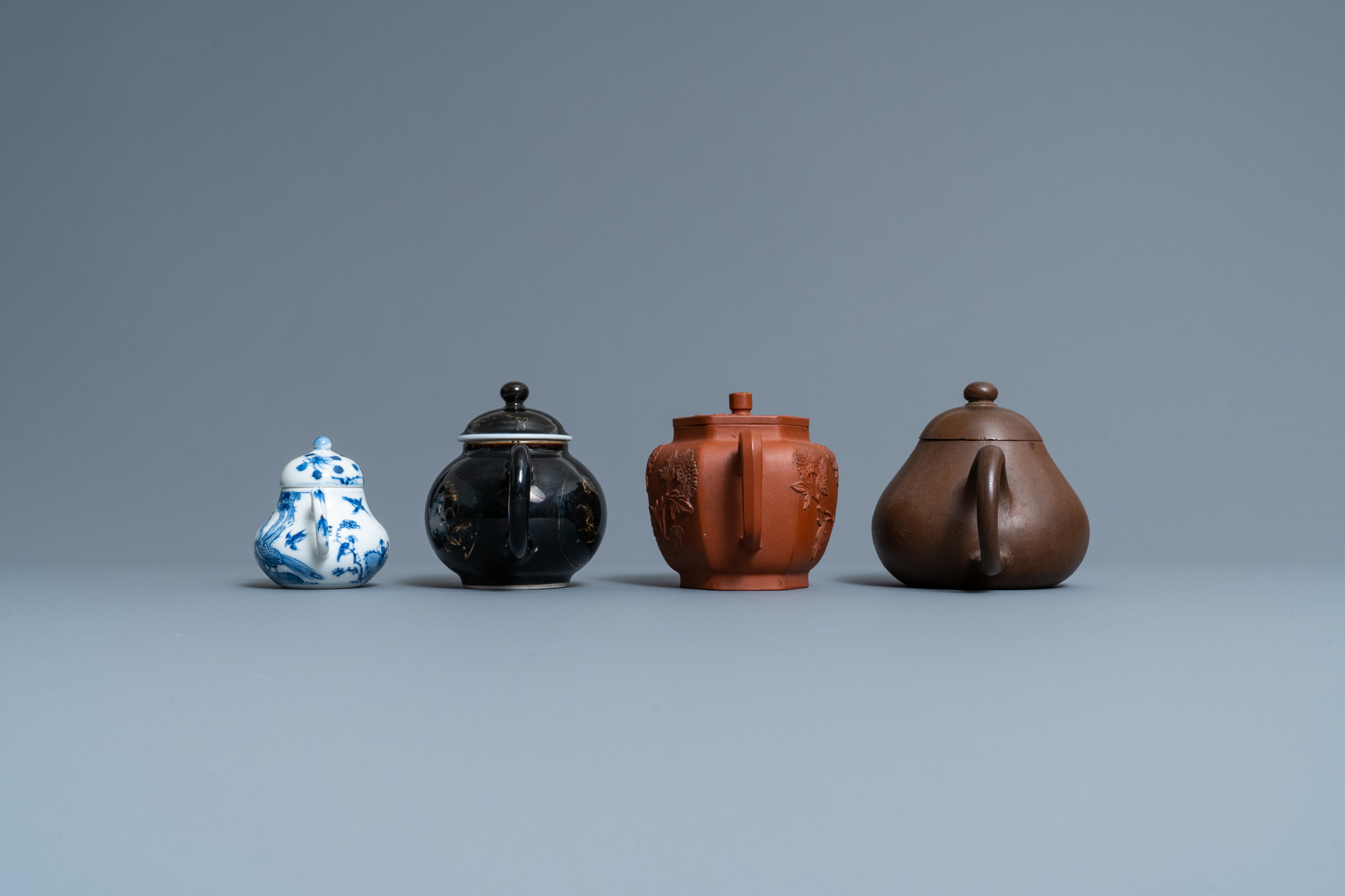 Four Chinese Yixing stoneware, blue and white and monochrome black porcelain teapots, Kangxi and lat - Image 5 of 9