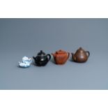 Four Chinese Yixing stoneware, blue and white and monochrome black porcelain teapots, Kangxi and lat