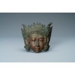 A bronze mask of a female deity, Tibet or South East Asia, 19th C.