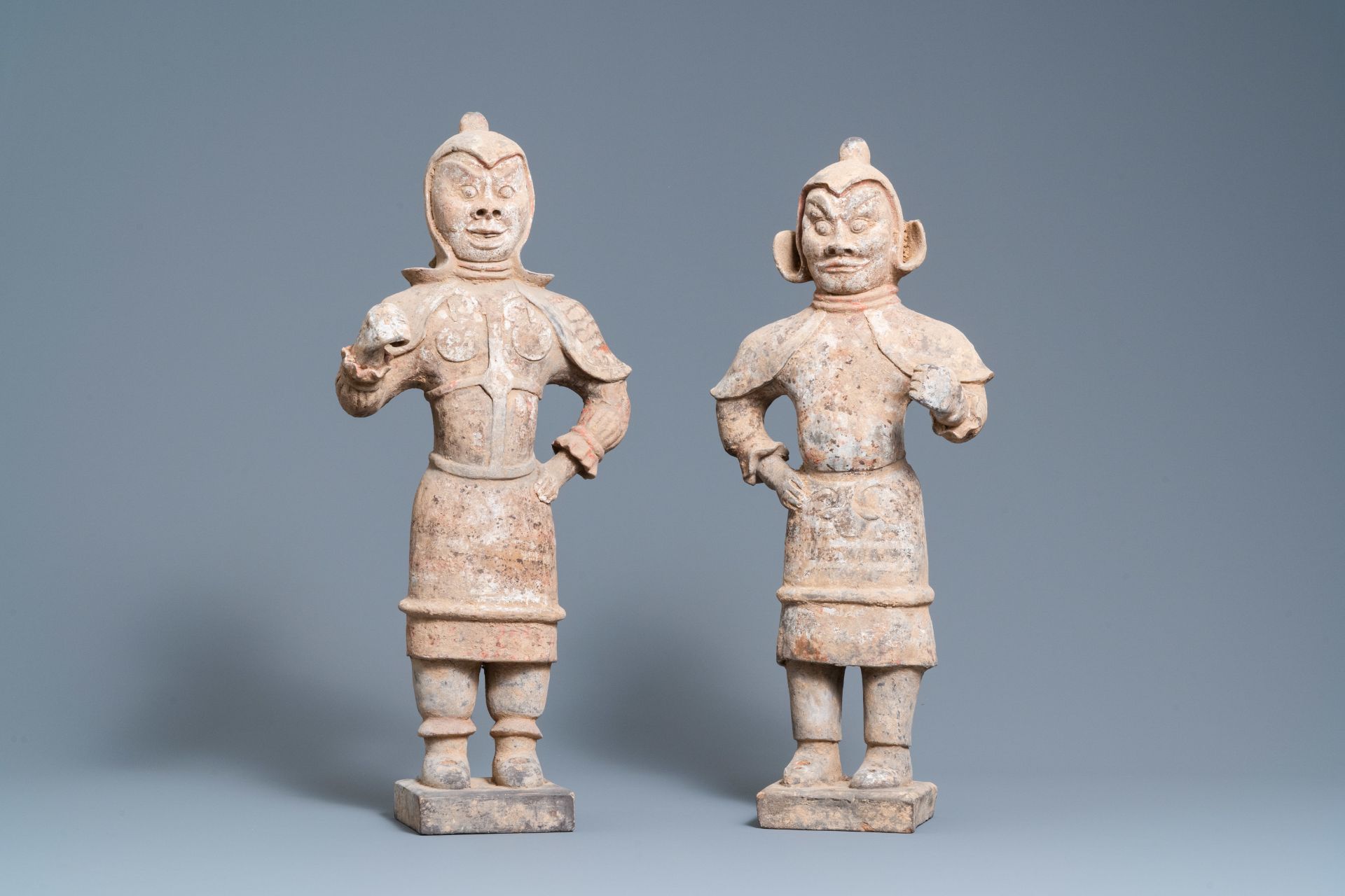 A pair of Chinese painted pottery 'Lokapala' guardian figures, Tang