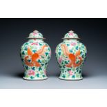 A pair of Chinese famille rose 'dragon and phoenix' vases, 19th C.