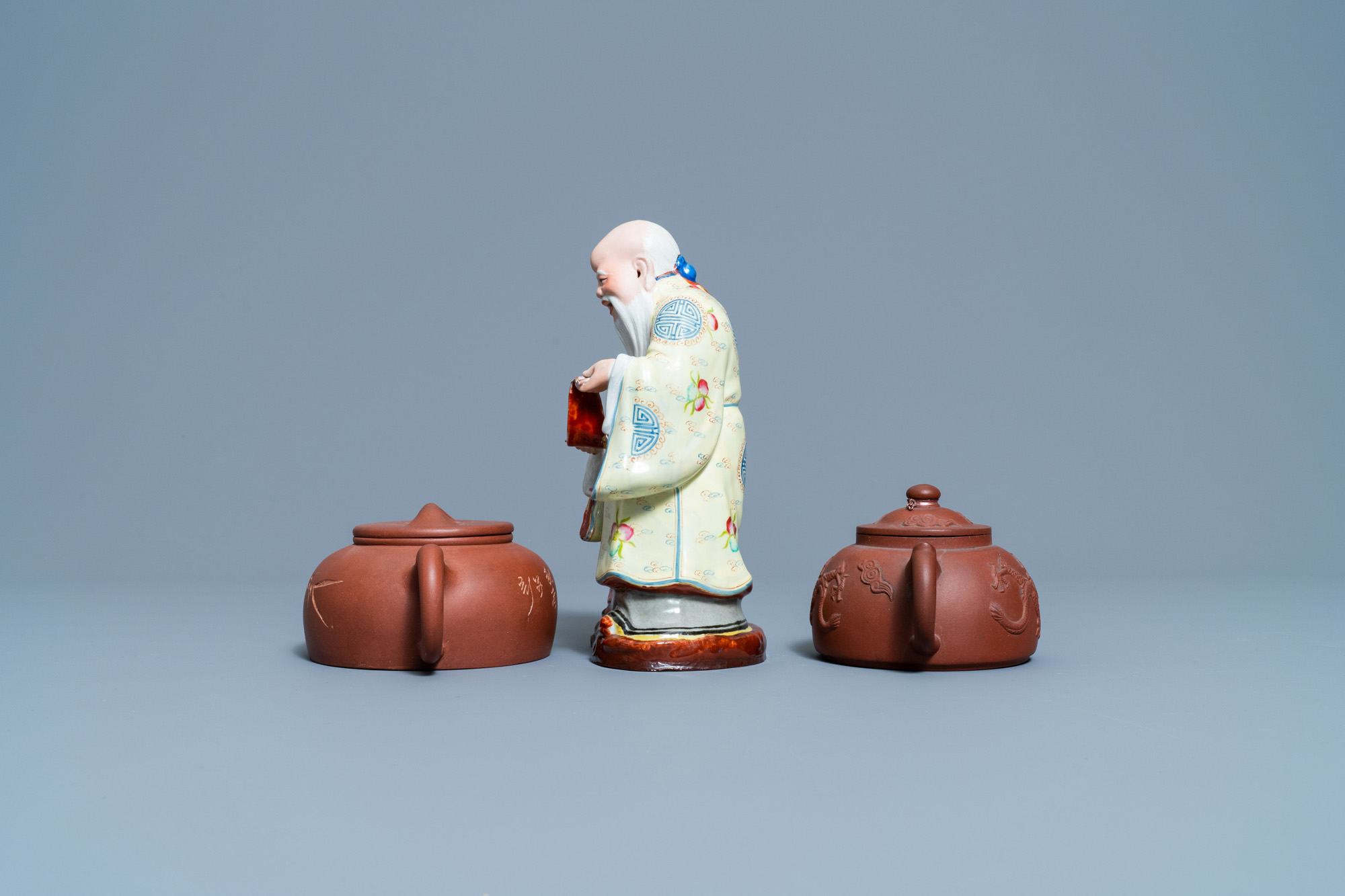 Two Chinese Yixing stoneware teapots and a famille rose 'Shou Lao' group, Kangxi and 20th C. - Image 3 of 7