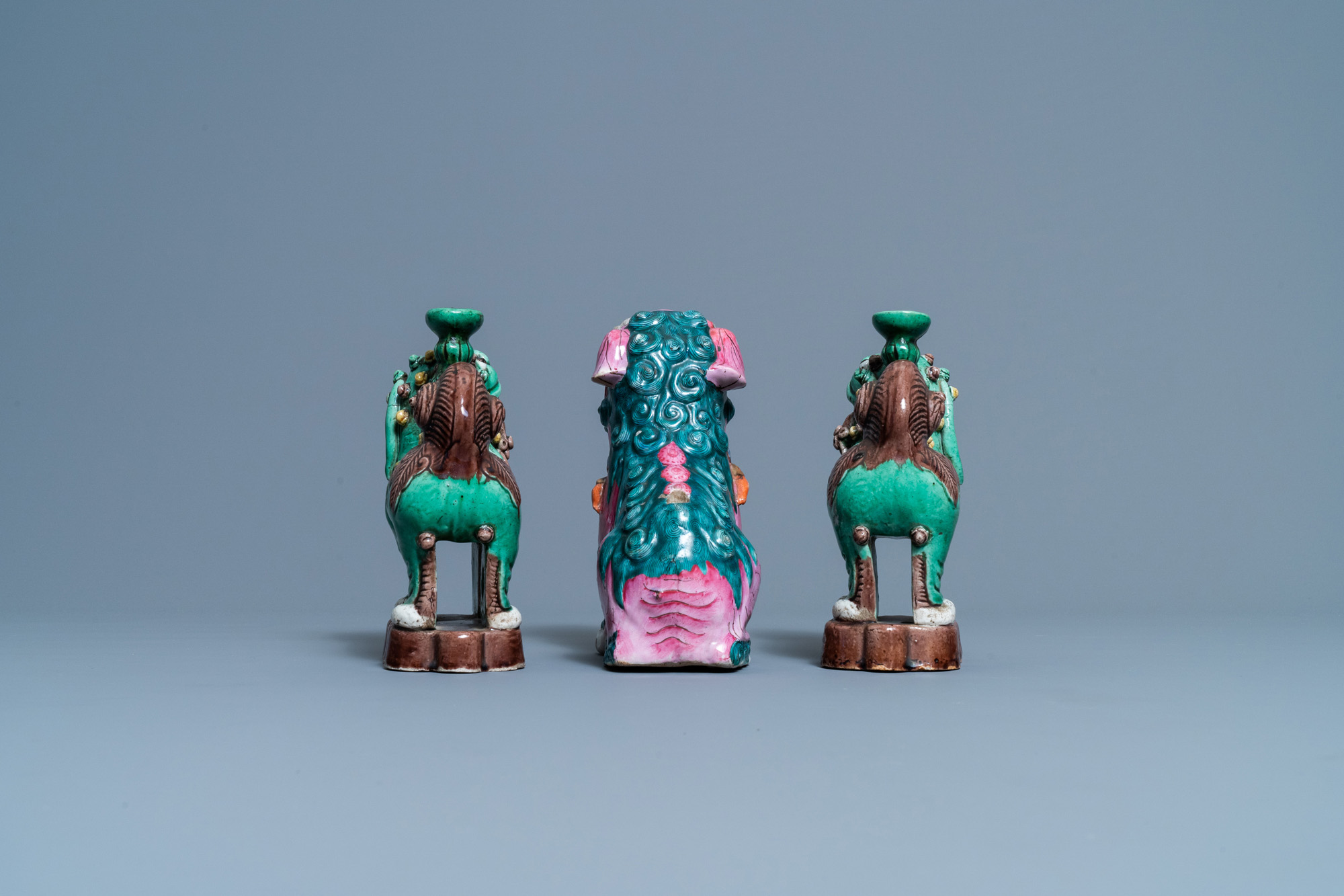 A Chinese famille rose model of a Buddhist lion and a pair of verte biscuit joss stick holders, 19th - Image 5 of 7