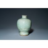 A Chinese Longquan celadon 'meiping' vase with incised floral design, Ming