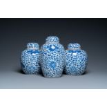 Three Chinese blue and white jars and covers with floral scrolls, 19th C.