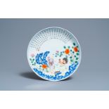 A Chinese famille rose dish with a boy, a hen and rooster and their chicks, Qianlong minyao mark and